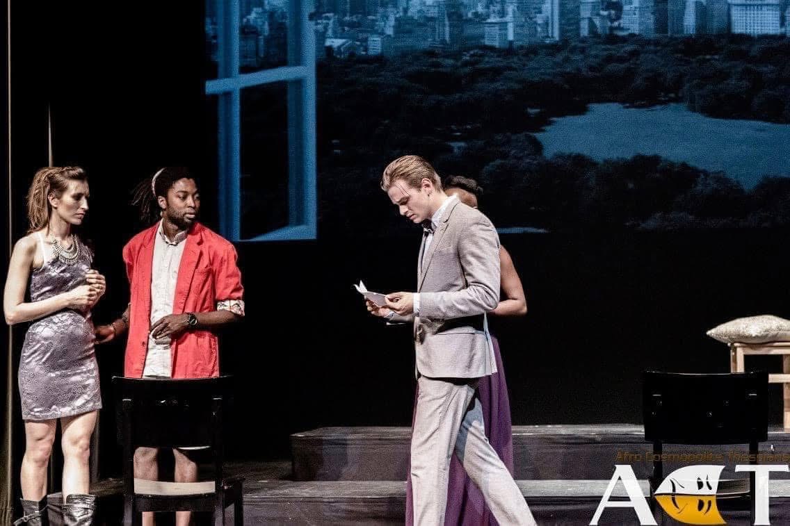 Bassanio reading and reflecting on stage in The Merchant of Venice.