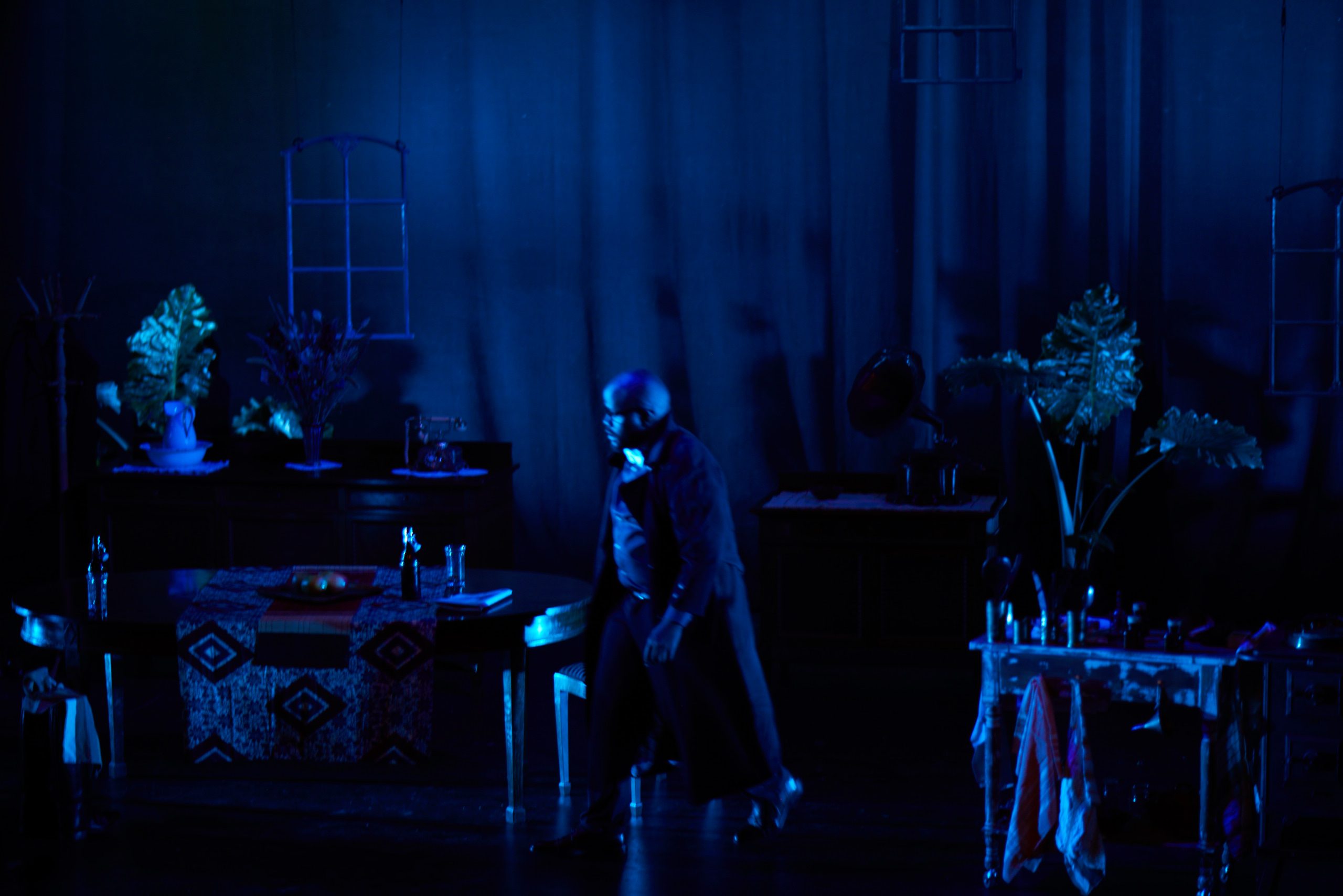 Blue-night stage image from Miss Julie’s Happy Valley.