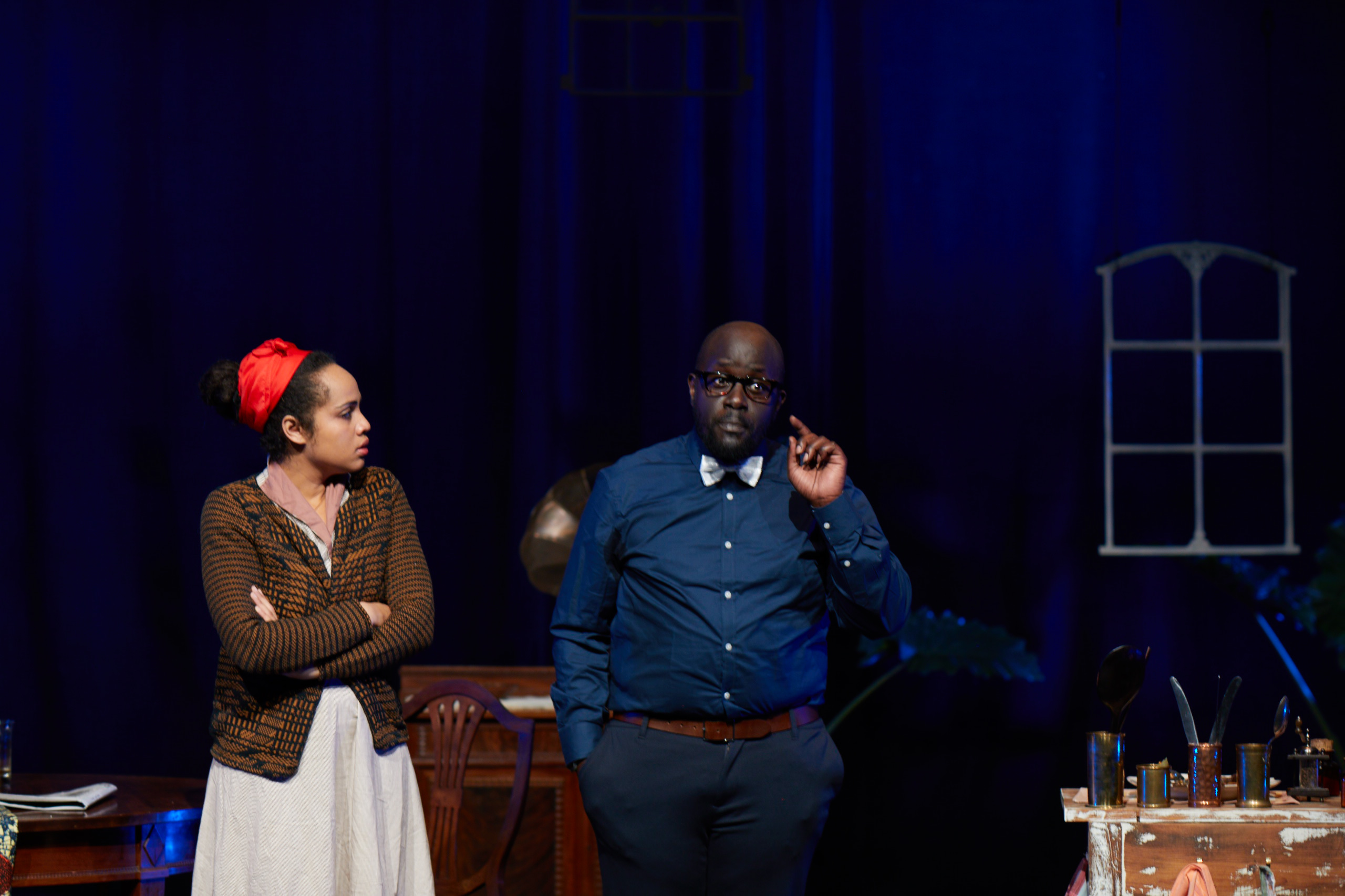 Christine and Jean studying the murder evidence in Miss Julie’s Happy Valley.