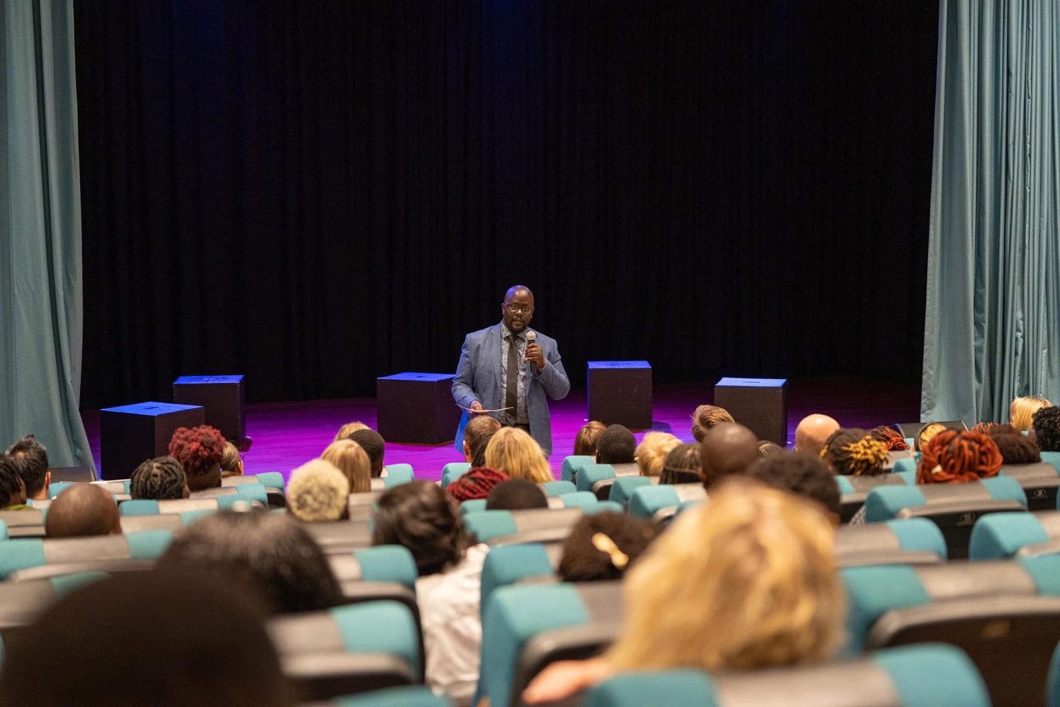 Michael Omoke, Artistic Director, addressing the audience at the University of Nairobi as part of the Silenced No More public programme.